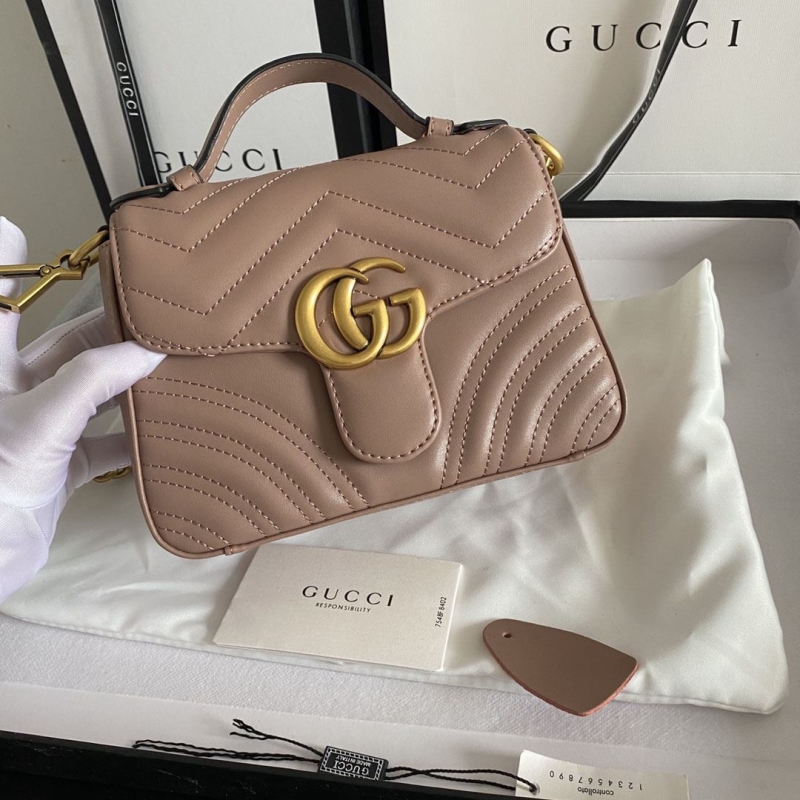 G*u*i top handle bags